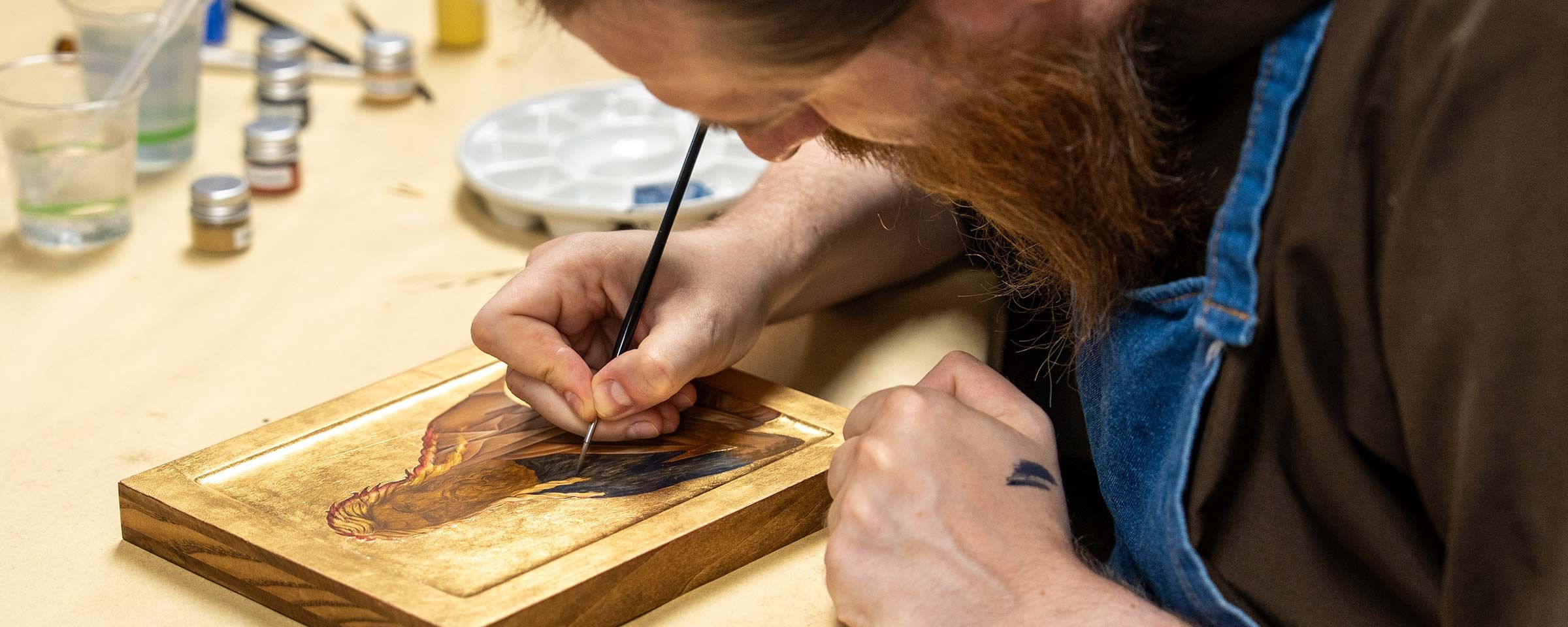 Brother Thomas painting an icon of Saint John the Baptist