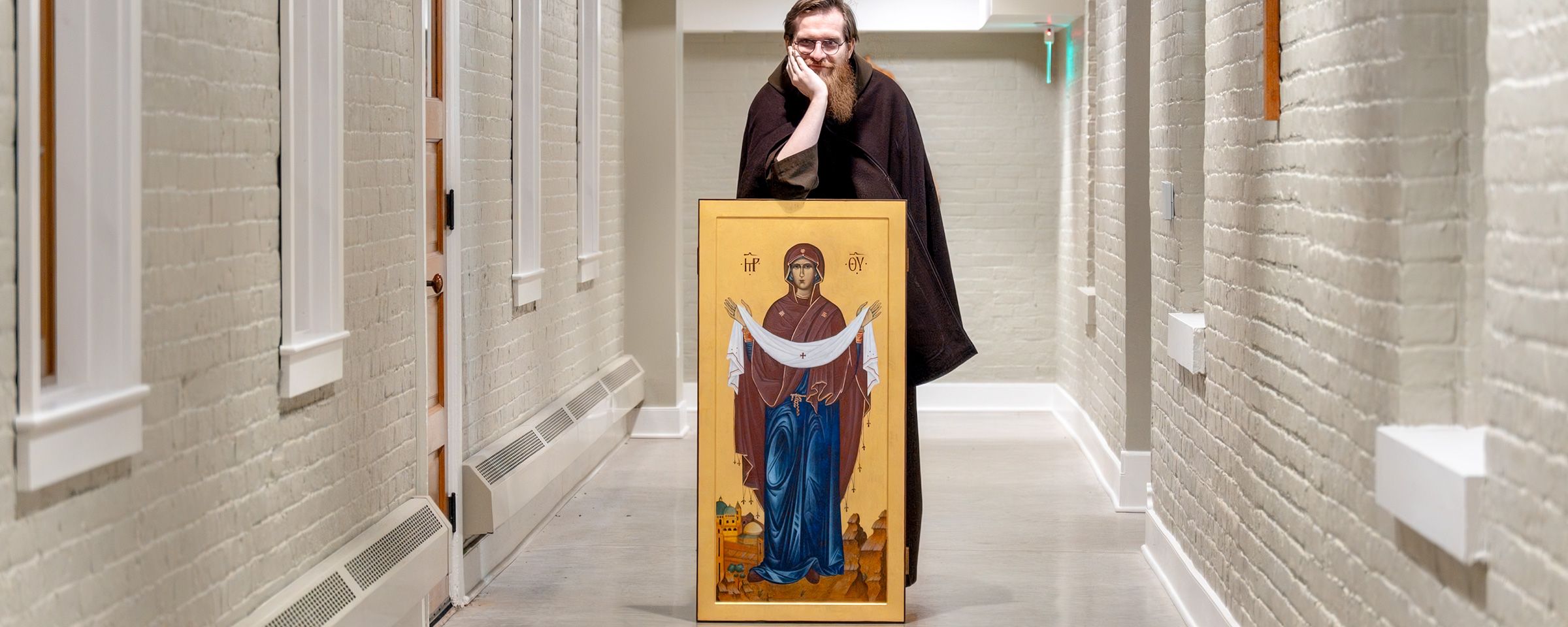 Brother Thomas with an icon of Our Lady of the Holy Land